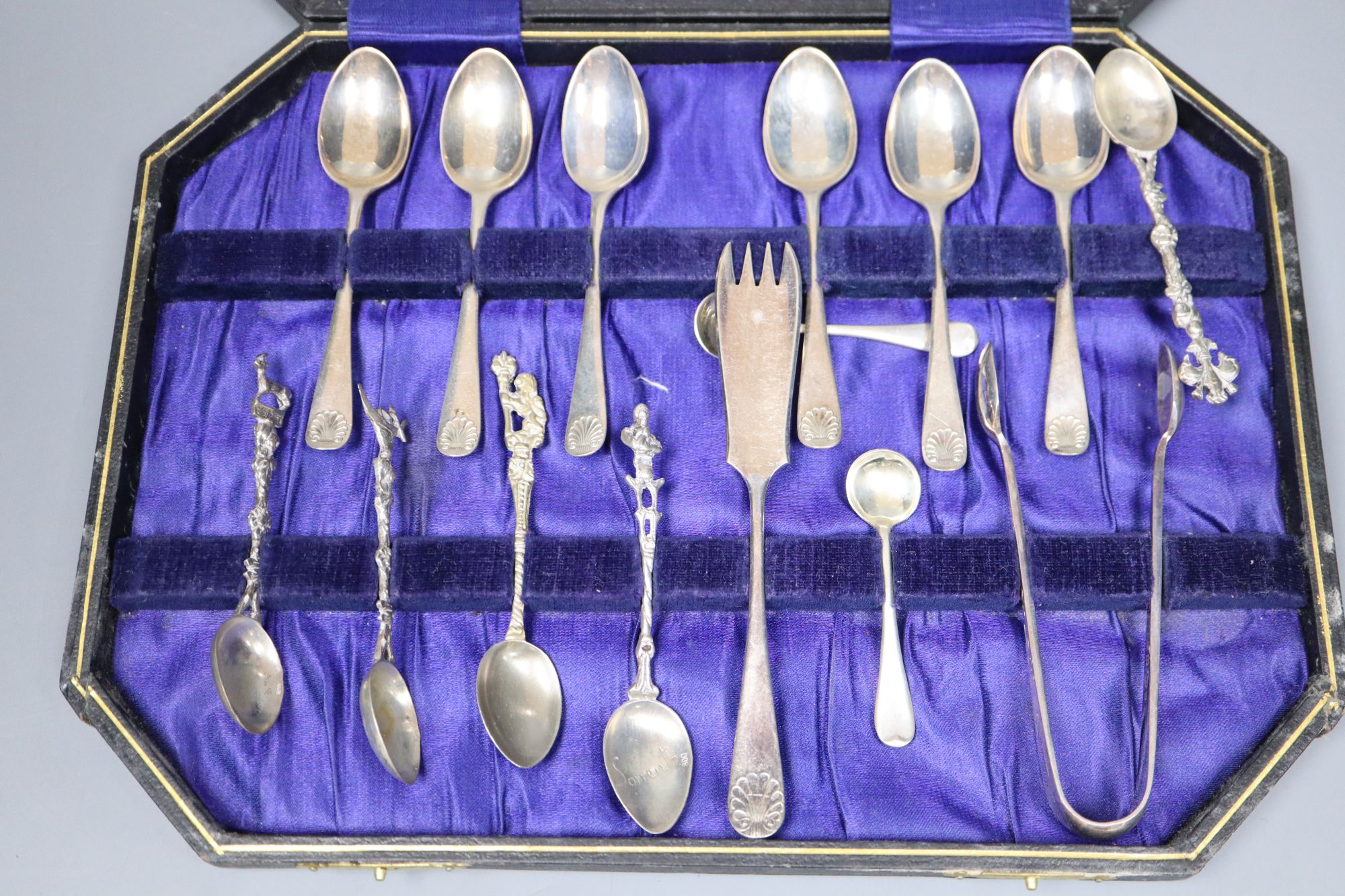 A set of six George V silver Old English and shell pattern teaspoons, other minor cutlery and three white metal napkin rings.